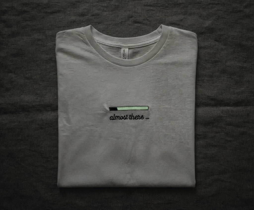 Almost There Tee — Glow-in-the-Dark Embroidered Loading Bar