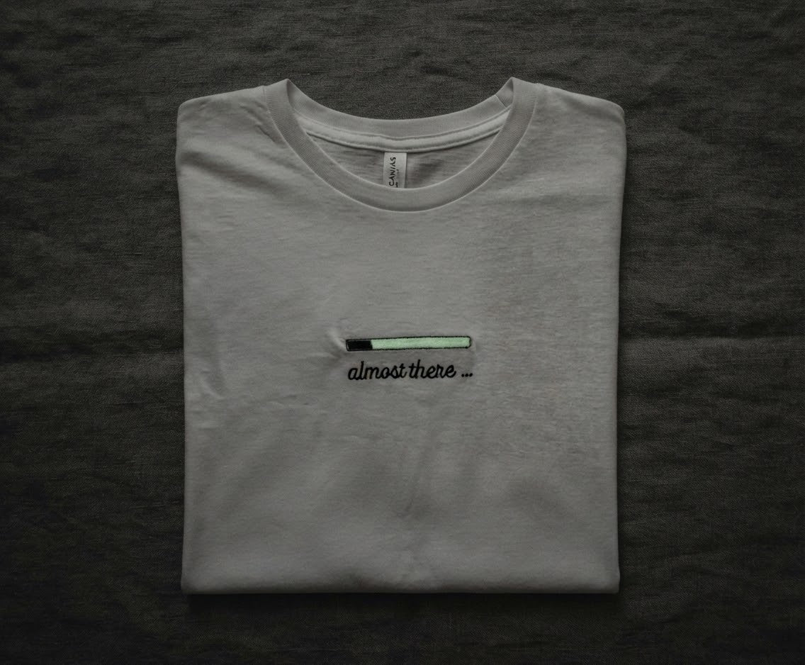 Almost There Tee — Glow-in-the-Dark Embroidered Loading Bar