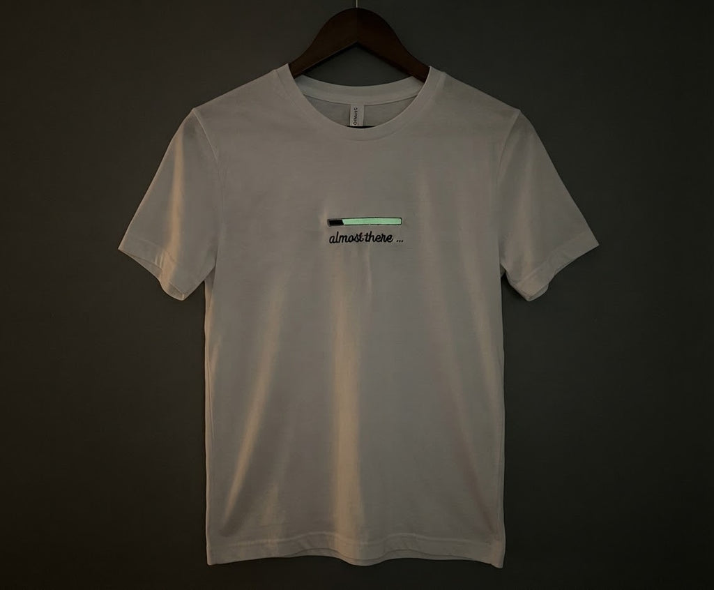 Almost There Tee — Glow-in-the-Dark Embroidered Loading Bar